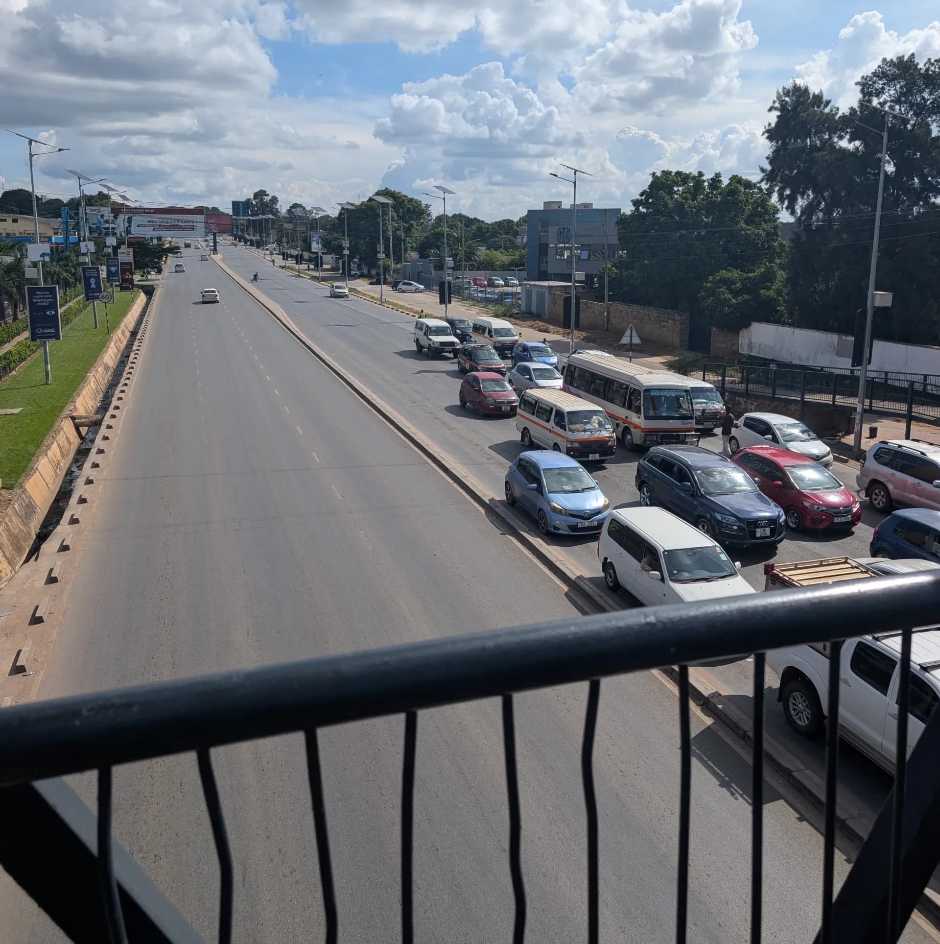 On a footbridge overlooking traffic in Lusaka