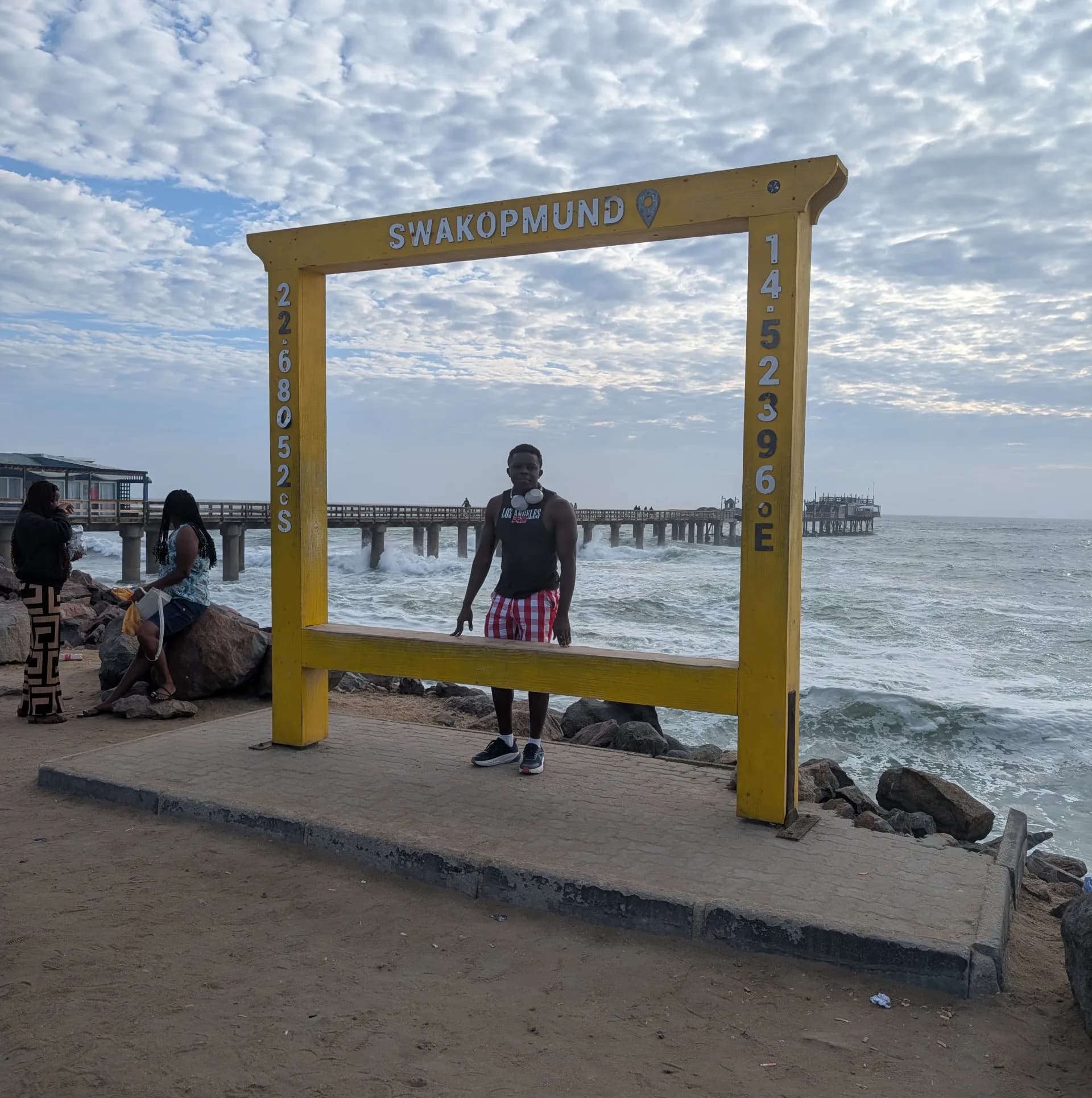 Sammy at the Welcome to Swakopmund sign