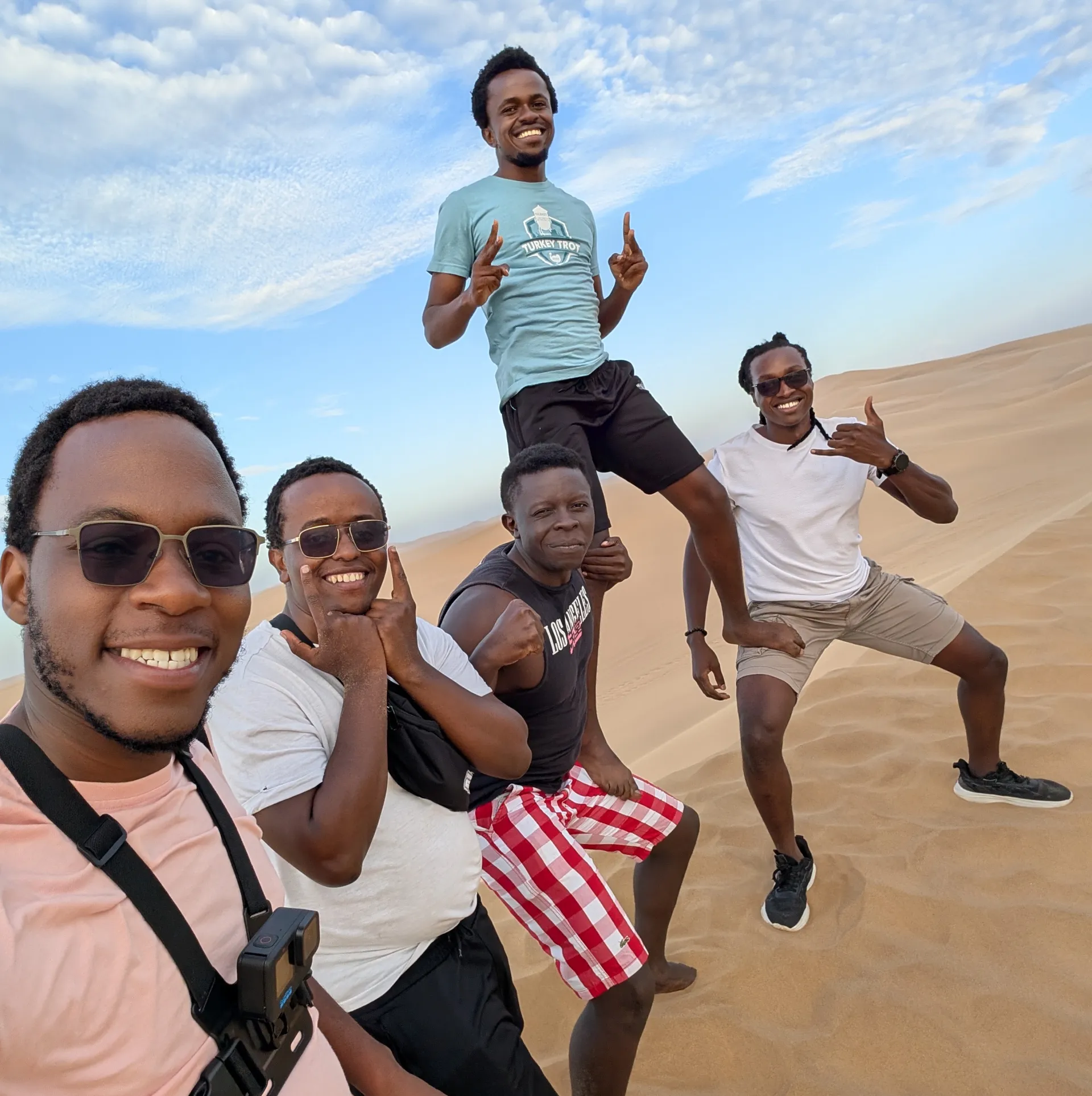 Posing for a photo in the desert overlooking the Atlantic Ocean